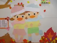 写真：たきびで温まっている壁飾り