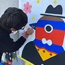 写真：14か所目制作中のイヌイマサノリさん